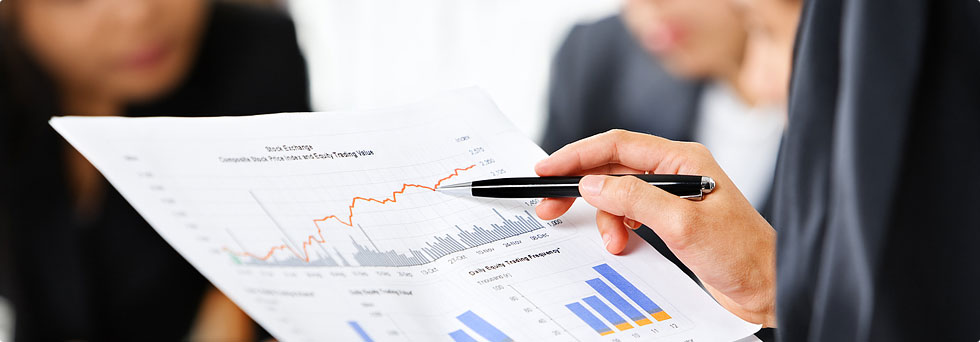 Business team analyzing financial data documents